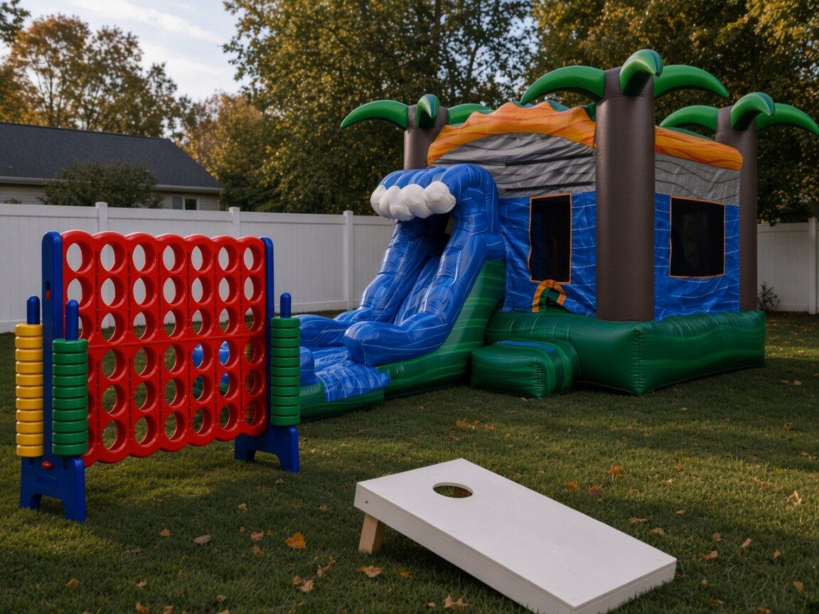 Styling idea: giant Connect 4, a cornhole board and a tropical bounce house with a slide in a fenced backyard